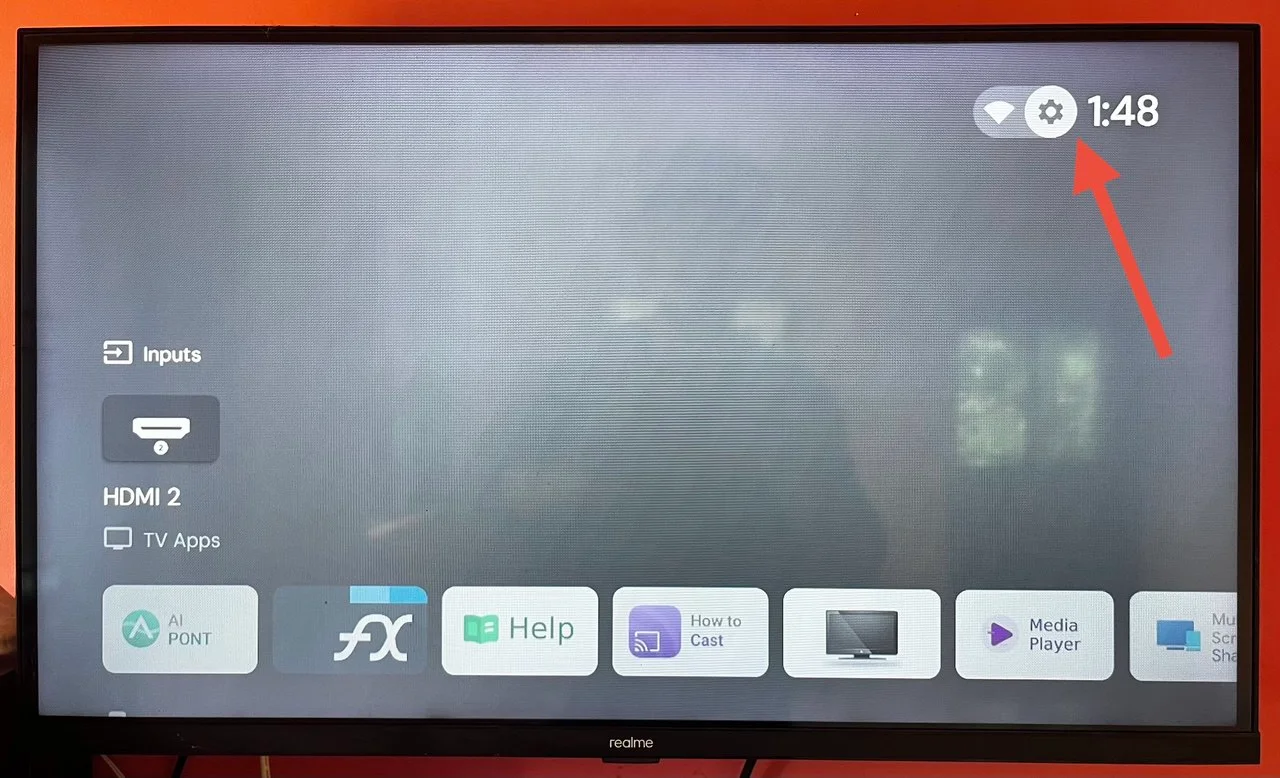 Projectivy Launcher home screen showing the settings gear icon at the top right