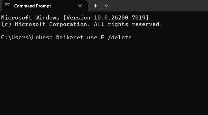 Use the net use F delete command to remove the mapped network drive