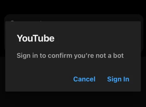 “YouTube Sign in to confirm that you're not a bot” error message shown on a mobile phone screen while watching a video
