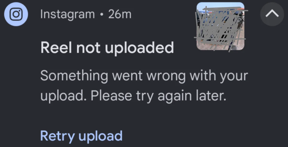Instagram error message showing "Something went wrong with your upload. Please try again later" on screen