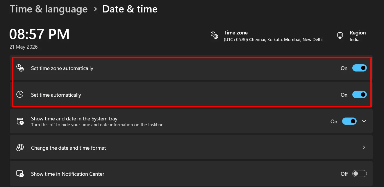Windows Date and Time settings page with Set time automatically and Set time zone automatically turned on