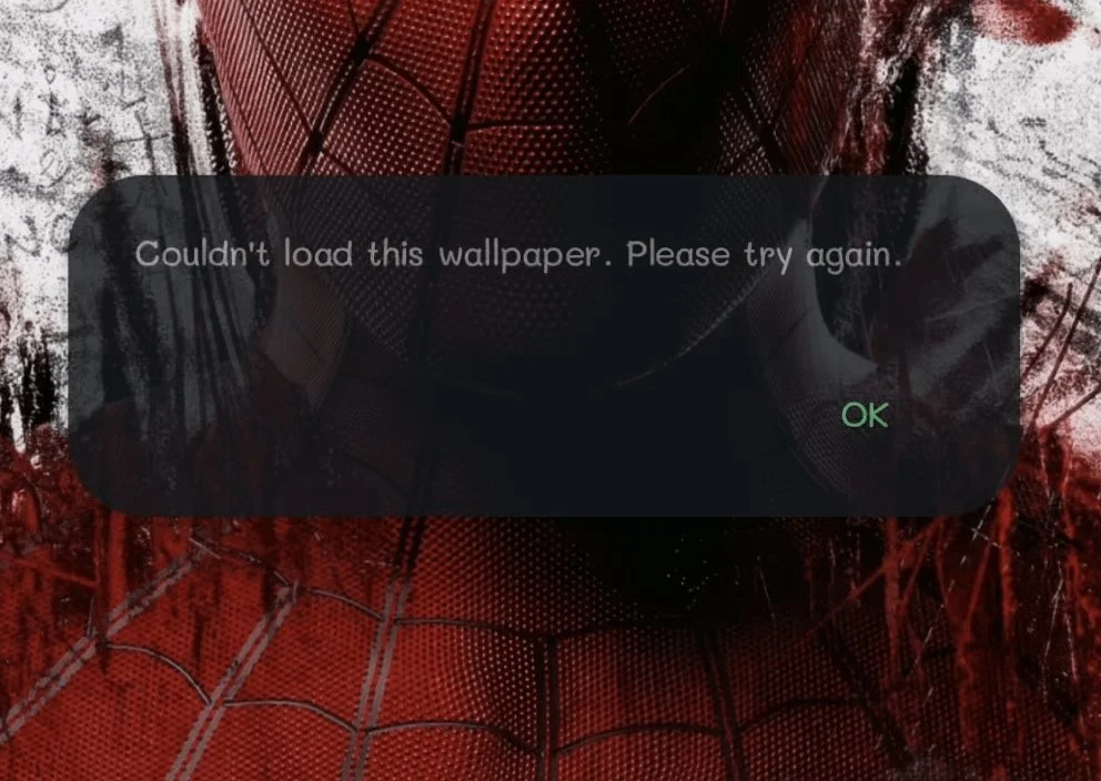 WhatsApp error message saying "Couldn't load this wallpaper. Please try again"
